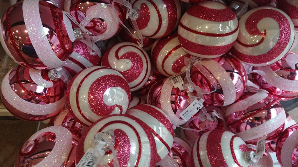 Tree with pink baubles. White tree with pink baubles. Pink and white swirly baubles.